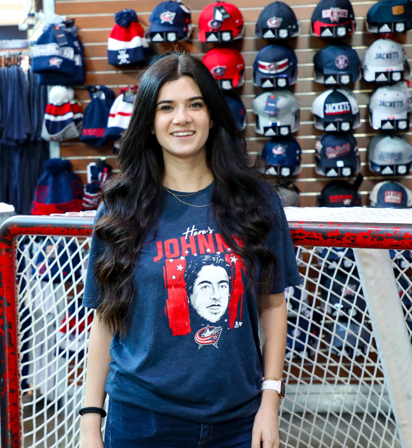 Woman featured wearing Columbus Blue Jacket gear at store